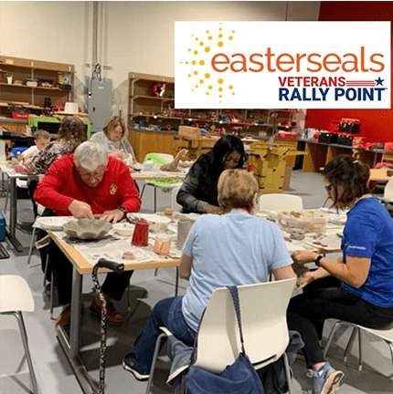 Elderly people and volunteers doing ceramics at  a table and a graphic easterseals veterans rally point logo